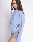 Fuzzy knit cardigan
Crewneck
Front button down closures
Long sleeves
Unlined
blue cardigan