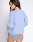 Fuzzy knit cardigan
Crewneck
Front button down closures
Long sleeves
Unlined
blue cardigan