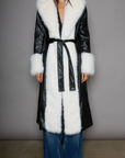 Faux leather longline coat. Faux fur trim. Collar neckline. Long sleeves. Open front. Tie waist. Fully lined. black leather coat. fur coat. coat for winter. cute leather coat. fashionable leather coat