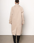 beige Longline trench coat
Pointed collar
Raglan sleeves
Welt pockets
Back slit
Midi-length
Button down closure