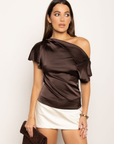 Satin asymmetrical off the shoulder top
Shoulder button closure
Front drape detail
Relaxed fit
Can be worn multiple ways
Side zipper closure
brown satin top
thanksgiving top outfit