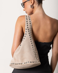 Beige suede tote bag with studded details