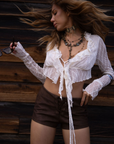 white Textured knit mesh crop top
Ruffle trim
Front tie closures
Long sleeves
Partially lined
coachella top
stagecoach top
festival outfit
boho top
boho outfit