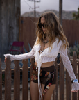 white Textured knit mesh crop top
Ruffle trim
Front tie closures
Long sleeves
Partially lined
coachella top
stagecoach top
festival outfit
boho top
boho outfit
