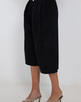 black Long line gaucho shorts
Jorts
Button/fly closure
4 pocket construction
Front pleating detail
Unlined