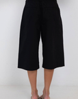 black Long line gaucho shorts
Jorts
Button/fly closure
4 pocket construction
Front pleating detail
Unlined