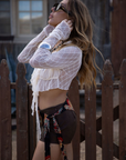 white Textured knit mesh crop top
Ruffle trim
Front tie closures
Long sleeves
Partially lined
coachella top
stagecoach top
festival outfit
boho top
boho outfit