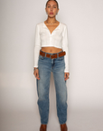 Eyelet pointelle cropped long sleeve
Cropped
Button down closure
Crewneck neckline
Has stretch
Unlined/partial sheer
White cropped long sleeve