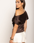 Satin asymmetrical off the shoulder top
Shoulder button closure
Front drape detail
Relaxed fit
Can be worn multiple ways
Side zipper closure
brown satin top
thanksgiving top outfit