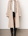 beige Longline trench coat
Pointed collar
Raglan sleeves
Welt pockets
Back slit
Midi-length
Button down closure