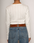 Eyelet pointelle cropped long sleeve
Cropped
Button down closure
Crewneck neckline
Has stretch
Unlined/partial sheer
White cropped long sleeve