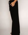 Woven pants
Elastic waist with drawstring closure
Side pockets
Unlined
black linen pants
resort lounge wear
summer pants