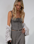 Plaid woven bustier top. Adjustable straps. Drawstring front closure. Front button down closures. Side zipper closure. Elastic smocked back panel. Fully lined. fall top. gingham top. thanksgiving outfit. friendsgiving outfit. fall outfit