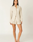 cream Oversized striped shirt
Button down closure
Lace up tie detail at back to adjust for a more fitted look
Shell buttons
Unlined