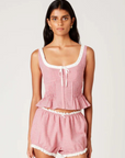 Gingham printed tank top
Figure-hugging bodice with peplum hem
Bodice pleating
Scoop neck with delicate trim & bow detailing
Front hook eyelet closure
red and white gingham tank top
fourth of july top outfit