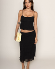 Chiffon polka dot midi skirt
Peek-a-boo under layer
Side zipper closure
Lined
black and white polka dot midi skirt
