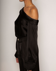 black Satin top. Folded off the shoulder neckline. Long sleeves with button closures. Unlined. black satin off the shoulder top.