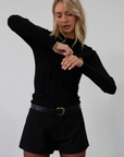 Knit top. Mock neck. Long sleeves. Lettuce edge hems. Unlined. black long sleeve. black ribbed long sleeve. fall top. fall outfit.