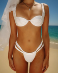 Underwire white bikini top
Scrunched bralette layered underneath
Wide adjustable tapered straps
Back hook closure
Sheen fabric
Nylon/Spandex
bridal swim
bridal swimwear
bridal bikini top