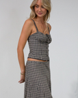 Plaid woven bustier top. Adjustable straps. Drawstring front closure. Front button down closures. Side zipper closure. Elastic smocked back panel. Fully lined. fall top. gingham top. thanksgiving outfit. friendsgiving outfit. fall outfit