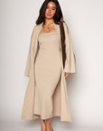 Ribbed knit longline cardigan. Open front. Long sleeves. Unlined. Ribbed knit maxi dress. Strapless elastic folded neckline. Back slit. Unlined. tan dress cardigan set