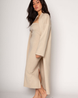 Ribbed knit longline cardigan. Open front. Long sleeves. Unlined. Ribbed knit maxi dress. Strapless elastic folded neckline. Back slit. Unlined. tan dress cardigan set