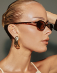 Square sunglasses
Featuring a sharp acetate frame with clean lines and a tortoise frame
Caramel tort – chocolate gradient lenses
Scratch-resistant Category 3 lenses
100% UV protection
Subtle branded detail on inner arms\
Width: 13.8m / Lens Heigh: 3.34cm / Arm Length: 14.2cm / Nose Bridge: 2.2cm
brown tort sunglasses