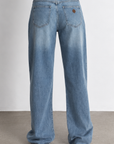 Designed with a mid-rise waist that sits just below your belly button
Relaxed fit through the butt, thighs, and legs for comfort, with a wide straight leg that bunches at the ankle for the ultimate Y2K look
Measurements for size 26
Rise: 11"
Inner Leg Length: 32"
Hem: 20"
Cotton/Recycled Cotton