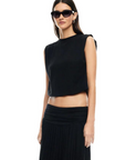 Knit muscle tank. Crewneck. Cropped boxy fit. Elastic hem. Fully lined.