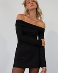 Knit dress. Folded elastic off the shoulder neckline. Long sleeves. Ruched sides. Fully lined. black mini dress. holiday dress. fall dress. friendsgiving outfit. thanksgiving outfit. off the shoulder dress
