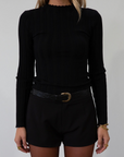 Knit top. Mock neck. Long sleeves. Lettuce edge hems. Unlined. black long sleeve. black ribbed long sleeve. fall top. fall outfit.