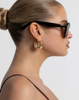 Oversized aviator frame
Featuring a straight brow line
Teardrop-shaped lenses
Distinctive keyhole bridge
Thick, structured frame with sculptural finish
tortoise frame with brown lens aviator sunglasses