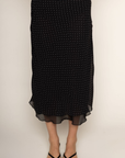 Chiffon polka dot midi skirt
Peek-a-boo under layer
Side zipper closure
Lined
black and white polka dot midi skirt