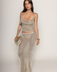 TOP:
Metallic knit cowl neck tank top
Unlined
Length: 17"
Polyester/Metallic
BOTTOM:
Metallic knot maxi skirt
Back slit
Elastic waistband
Unlined
Length: 43"
metallic gold maxi skirt set