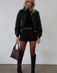 Knit top. Mock neck. Long sleeves. Lettuce edge hems. Unlined. black long sleeve. black ribbed long sleeve. fall top. fall outfit.