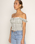 green Woven plaid top
Faux front button
Adjustable front tie
Lace bust trim detail
Smocked shoulder sleeves and back
Side zipper
Unlined
summer top
spring top