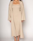 Ribbed knit longline cardigan. Open front. Long sleeves. Unlined. Ribbed knit maxi dress. Strapless elastic folded neckline. Back slit. Unlined. tan dress cardigan set