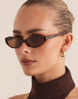 Oval slimline sunglasses
Sleek profile and lightweight acetate frame
Polarised, scratch-resistant Category 3 lenses
100% UV protection
Gold foil style detailing on inner right arm