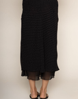 Chiffon polka dot midi skirt
Peek-a-boo under layer
Side zipper closure
Lined
black and white polka dot midi skirt