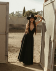 Woven maxi dress. Adjustable crisscross back straps. Back hook and eye and zipper closures. Fully lined. black maxi dress. country outfit. country dress. western outfit. western dress.