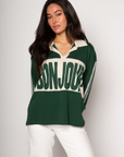 Graphic printed knit top. Collar neckline. Long sleeves. Unlined. green graphic long sleeve tee. bonjour tee