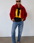 Faux fur coat. Collar neckline. Front zipper closure. Side pockets. Fully lined. red fur coat. fall coat. winter coat. red faux fur coat