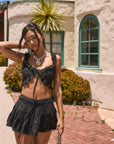 Woven tiered skirt. Elastic waist with drawstring closure. Shorts lining. Black mini skirt. skirt for summer. summer outfit. summer skirt. black skort. cute summer outfit