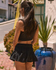 Woven tiered skirt. Elastic waist with drawstring closure. Shorts lining. Black mini skirt. skirt for summer. summer outfit. summer skirt. black skort. cute summer outfit