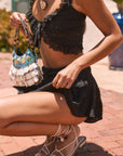 Woven tiered skirt. Elastic waist with drawstring closure. Shorts lining. Black mini skirt. skirt for summer. summer outfit. summer skirt. black skort. cute summer outfit