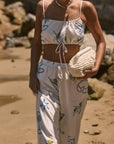Printed woven wide leg pants. Elastic waistband with drawstring closure. Side pockets. Fully lined. lemon pant. grape and wine pant. summer throw on pant. cute graphic linen pant. european summer pant. summer pant. vacation outfit. cute summer set.