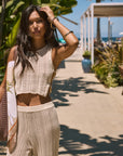 Open knit crop tank. Side cut outs and faux ring details. Unlined/sheer. Open knit crochet pants. Elastic waistband. Unlined/sheer. Beach cover up. beach set. knit crochet set. knit crochet tank. knit crochet pant. tan knit crochet pant set. european summer outfit. european summer set. amalfi coast outfit.