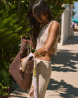 Open knit crop tank. Side cut outs and faux ring details. Unlined/sheer. Open knit crochet pants. Elastic waistband. Unlined/sheer. Beach cover up. beach set. knit crochet set. knit crochet tank. knit crochet pant. tan knit crochet pant set. european summer outfit. european summer set. amalfi coast outfit.