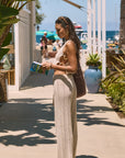 Open knit crop tank. Side cut outs and faux ring details. Unlined/sheer. Open knit crochet pants. Elastic waistband. Unlined/sheer. Beach cover up. beach set. knit crochet set. knit crochet tank. knit crochet pant. tan knit crochet pant set. european summer outfit. european summer set. amalfi coast outfit.