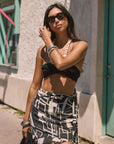 Printed woven chiffon skirt. Side hook and eye and zipper closure. Tie waist. Beaded waist strap. Fully lined. beach cover up. beach skirt cover up. vacation outfit. european summer outfit. black and white skirt. summer skirt. mexico outfit.